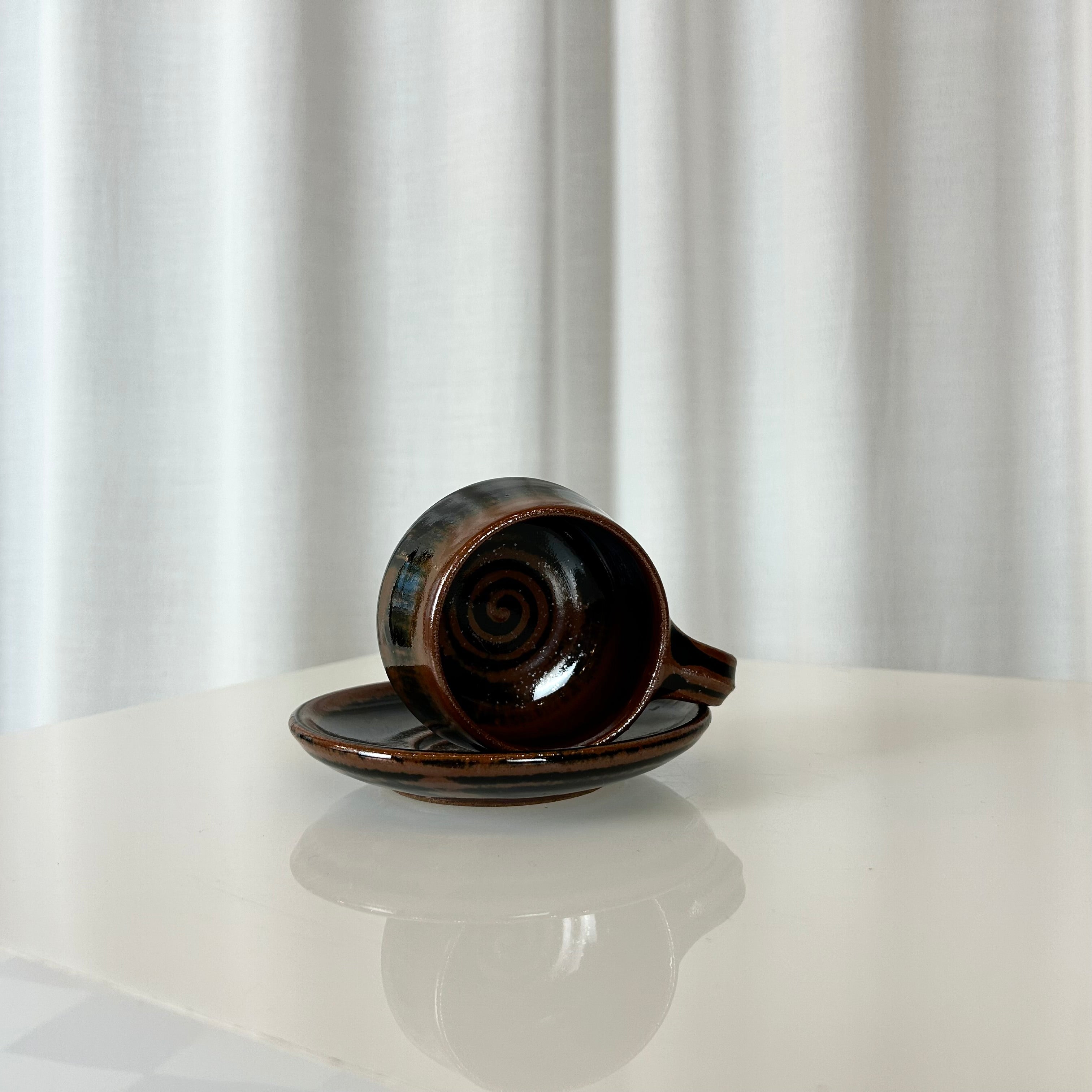 Ceramic cup and saucer from Aylesford, inside