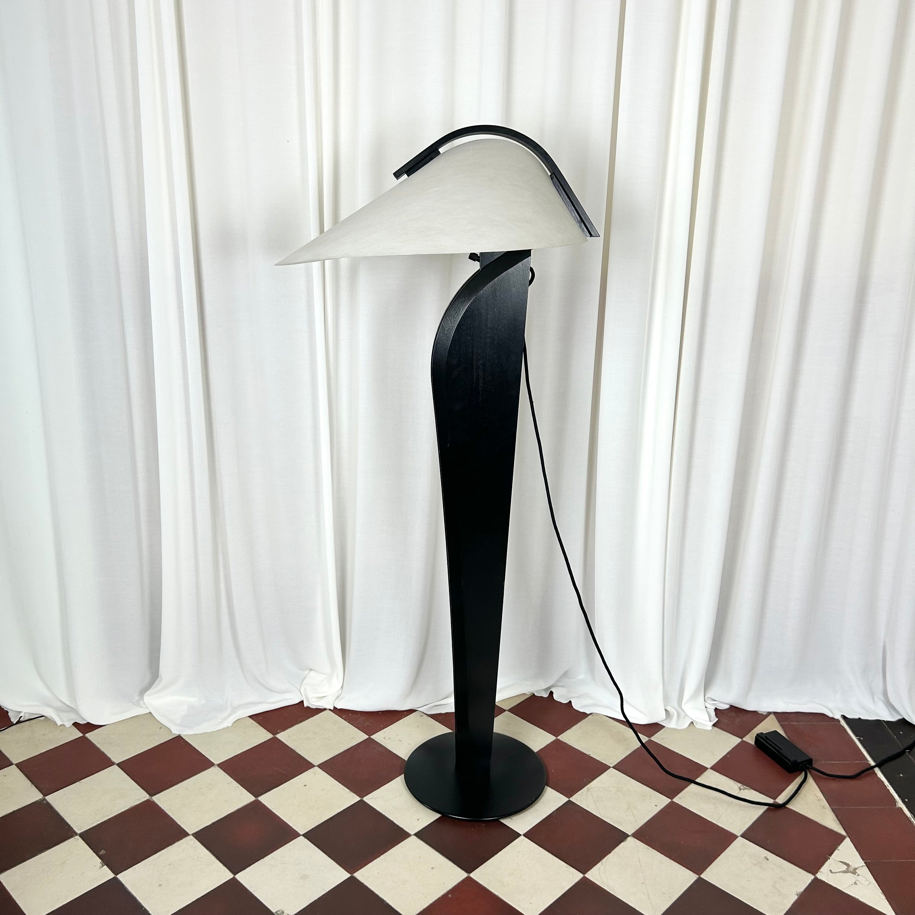 A black and white 1970's floorlamp by the Danish manufacturer Domus, seen in profile