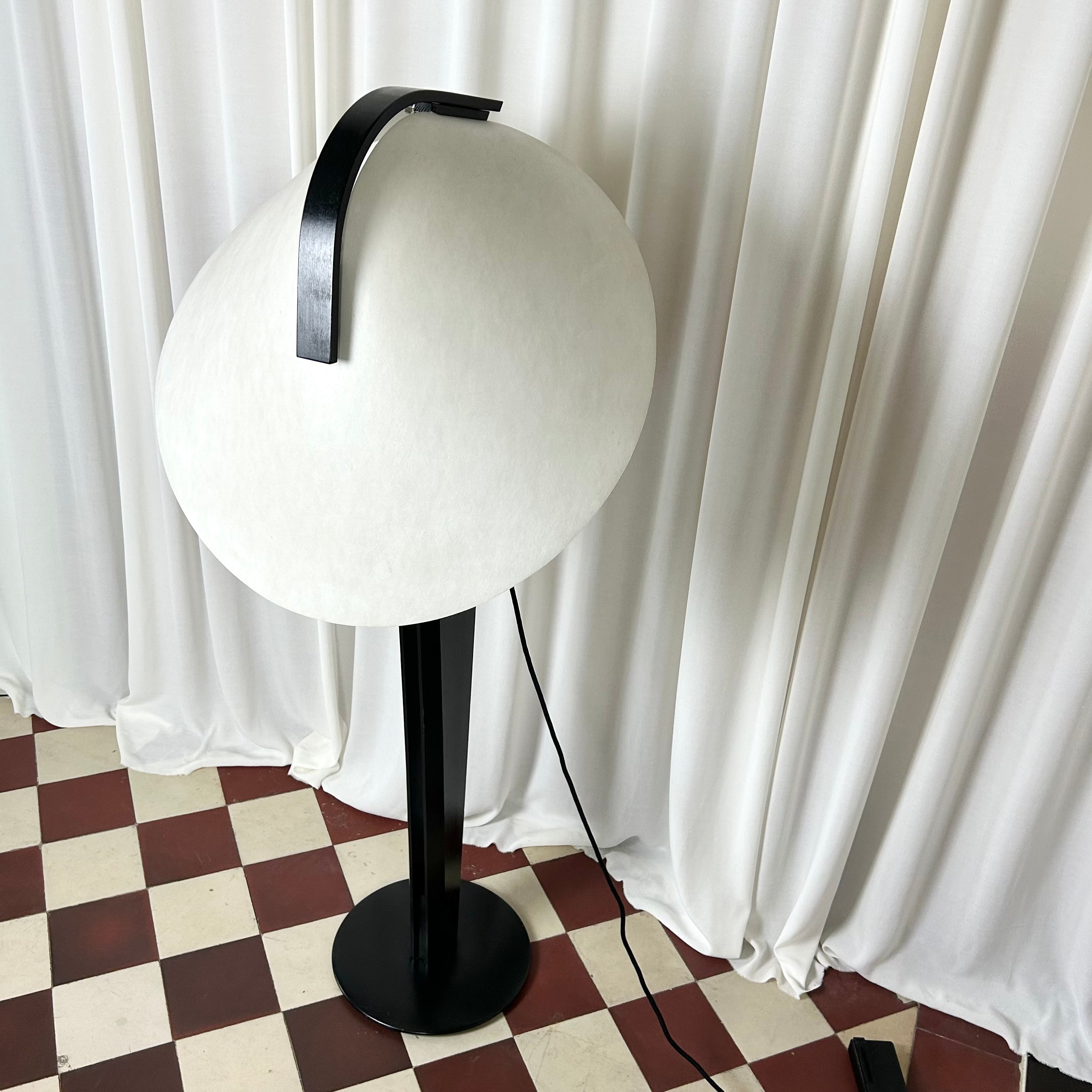 Side image of a black and white 1970's floorlamp by the Danish manufacturer Domus