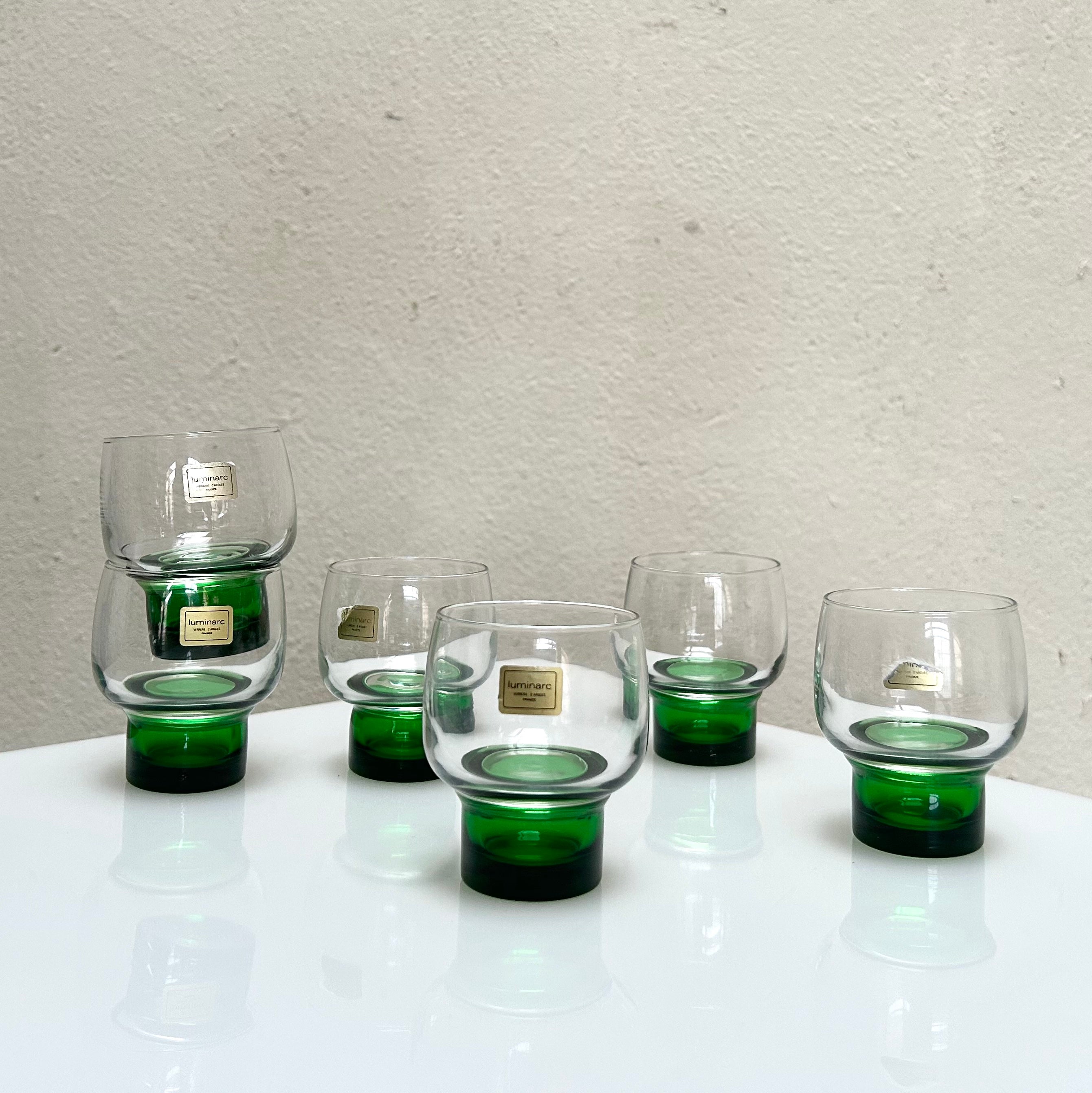 clear vintage glasses with a deep green wide stem by the french brand Luminarc