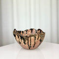Vintage handmade ceramic bowl with irregular rim