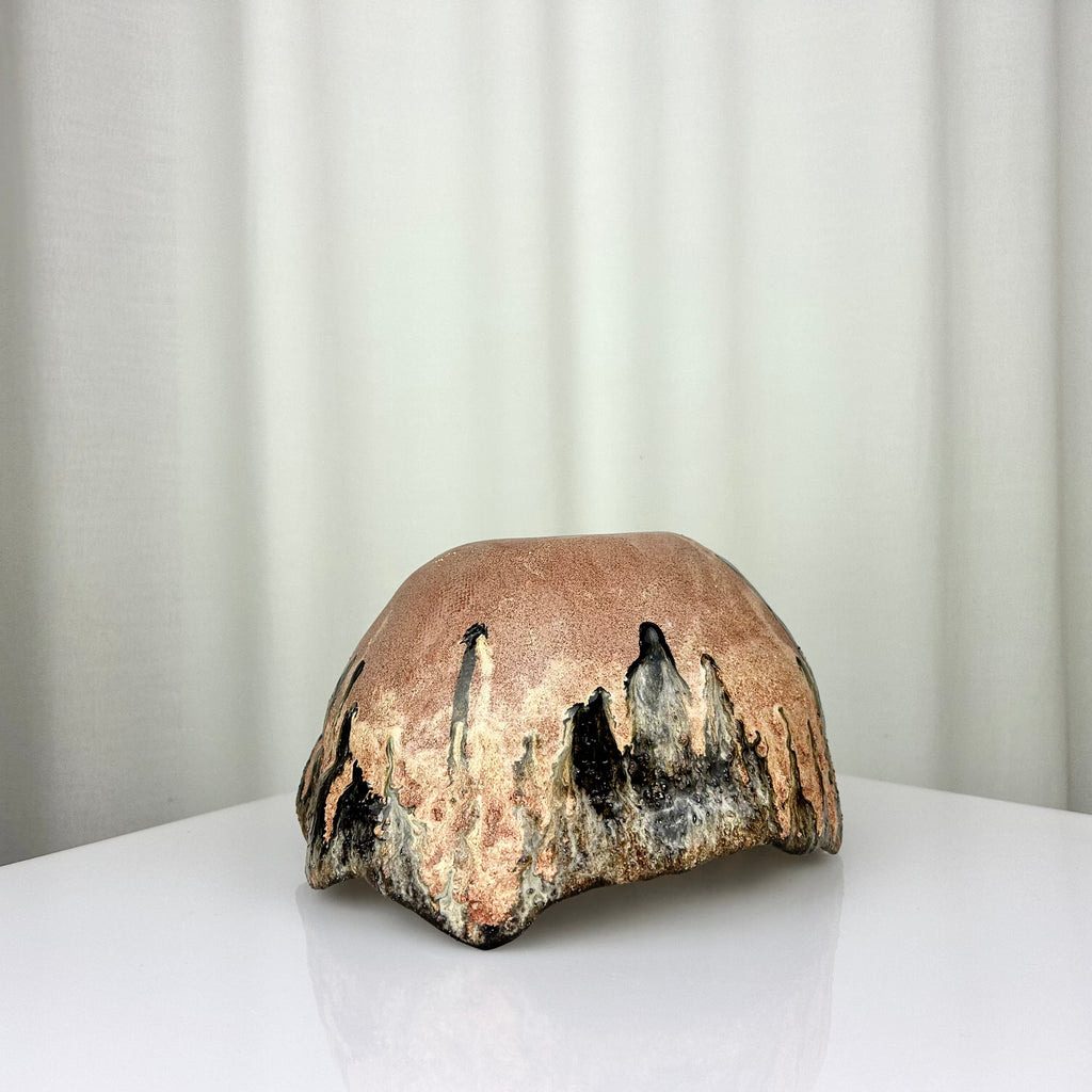 Vintage handmade ceramic bowl with irregular rim, upside down