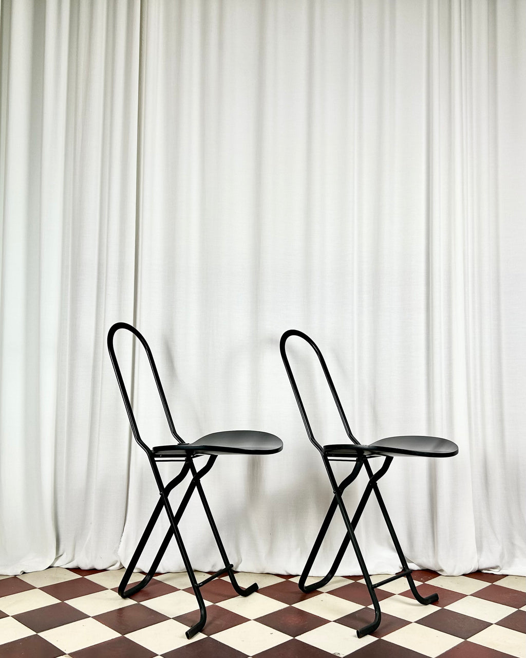 Two black foldable "Dafne" chairs by Gastone Rinaldi for the Italian manufacturer Thema