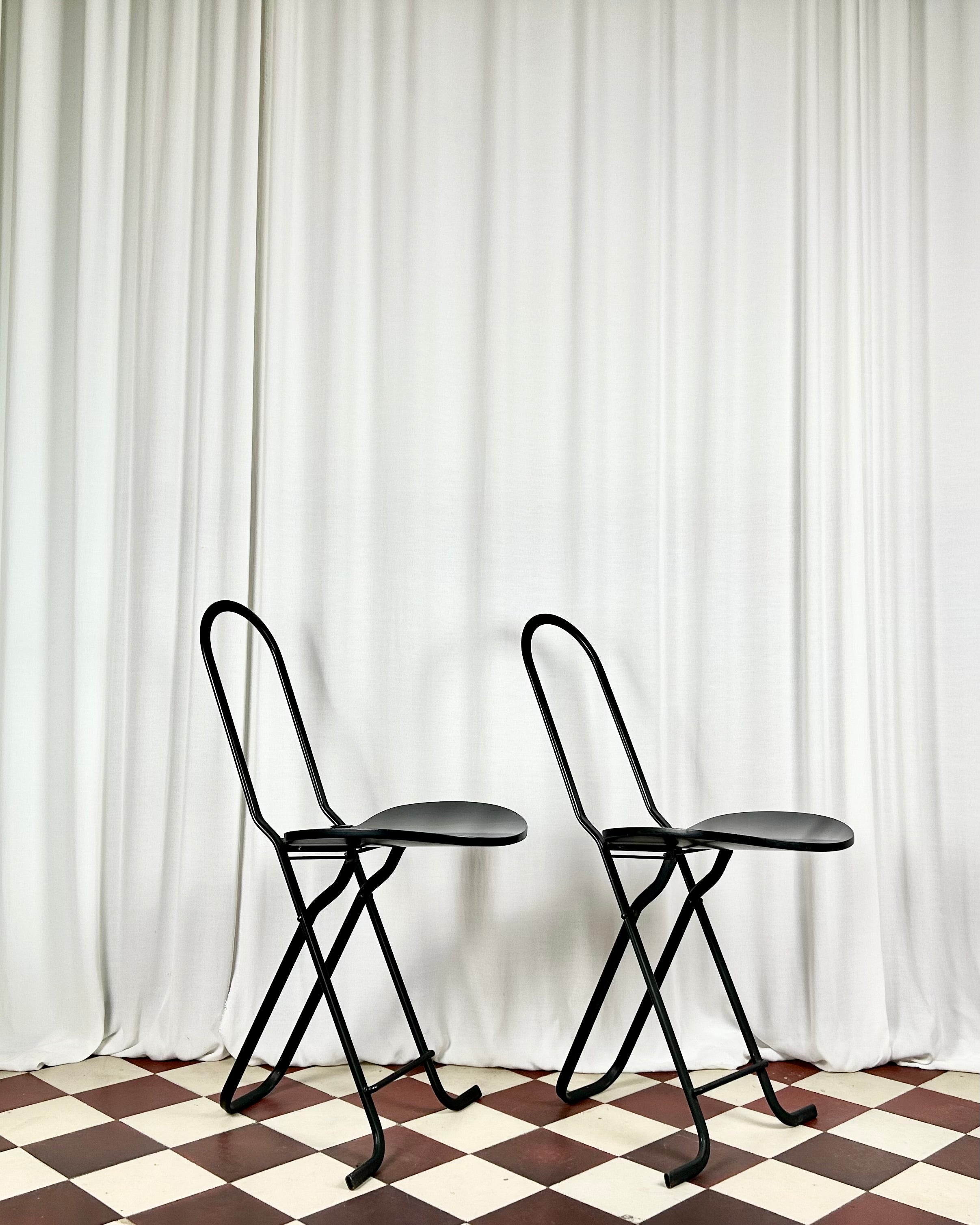 Two black foldable "Dafne" chairs by Gastone Rinaldi for the Italian manufacturer Thema