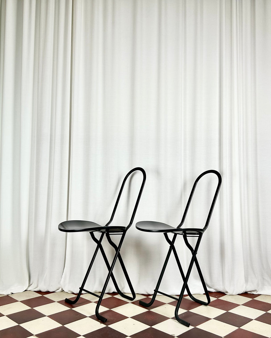 Two black foldable "Dafne" chairs by Gastone Rinaldi for the Italian manufacturer Thema