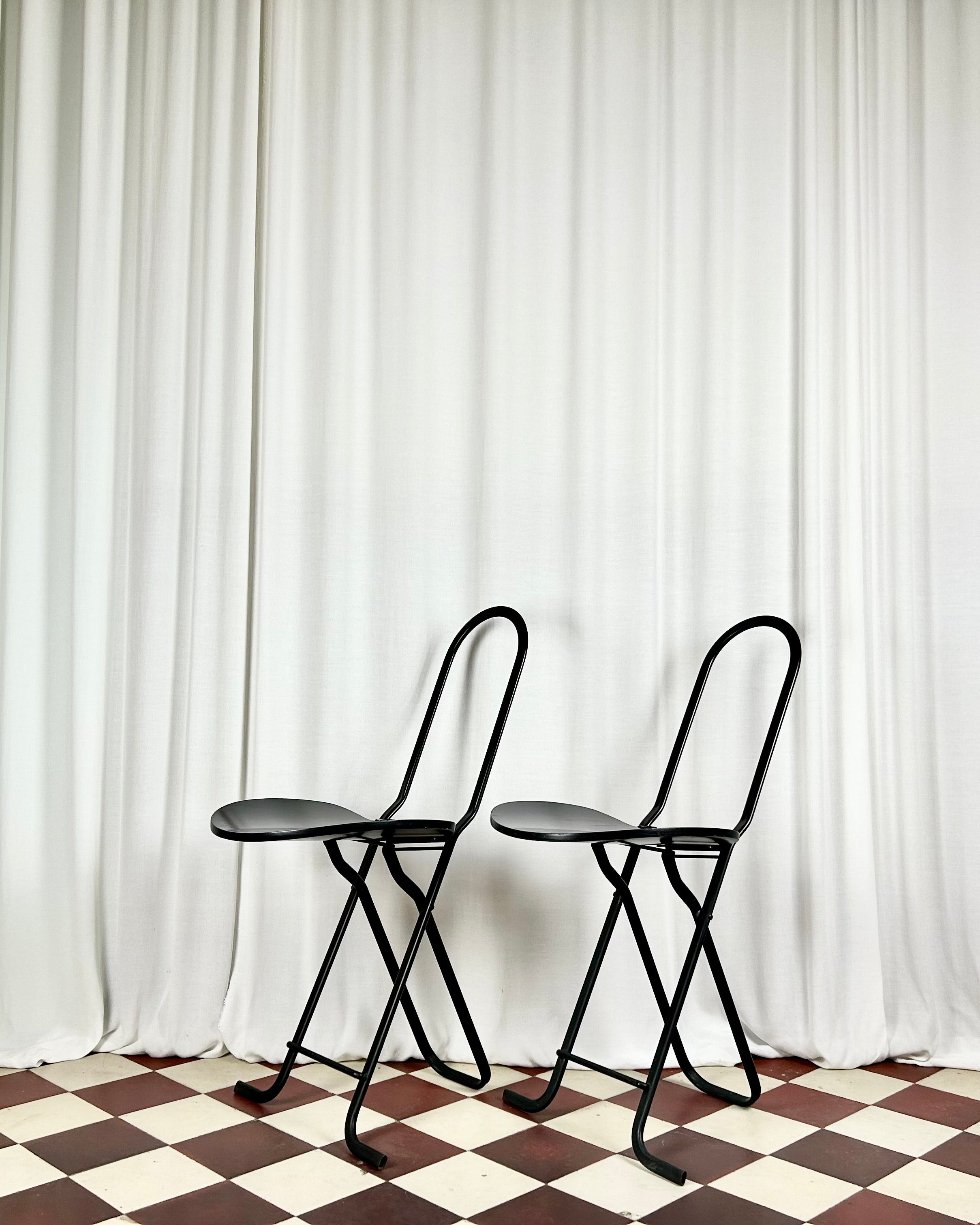 Two black foldable "Dafne" chairs by Gastone Rinaldi for the Italian manufacturer Thema