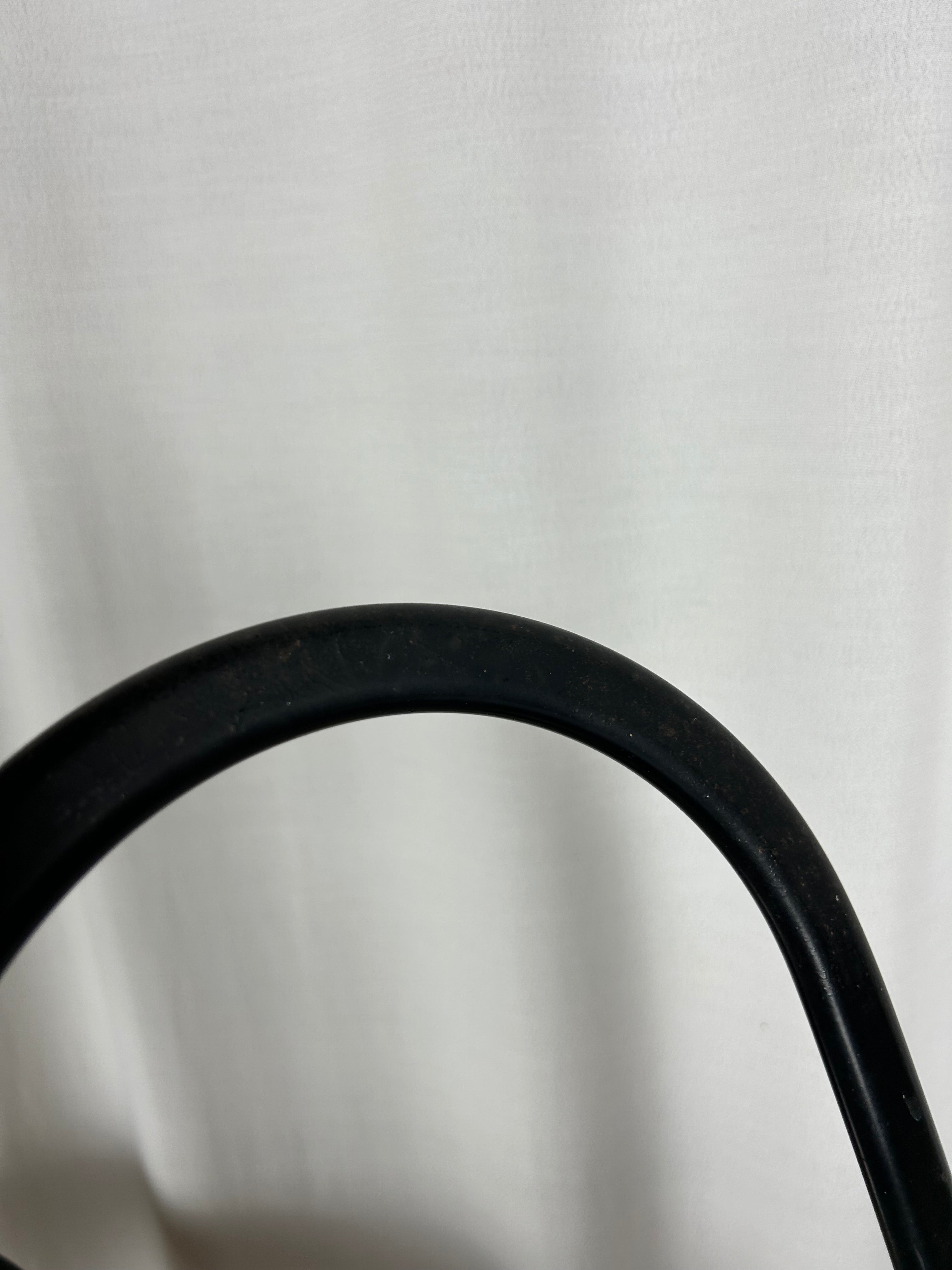 Two black foldable "Dafne" chairs by Gastone Rinaldi for the Italian manufacturer Thema, closeup