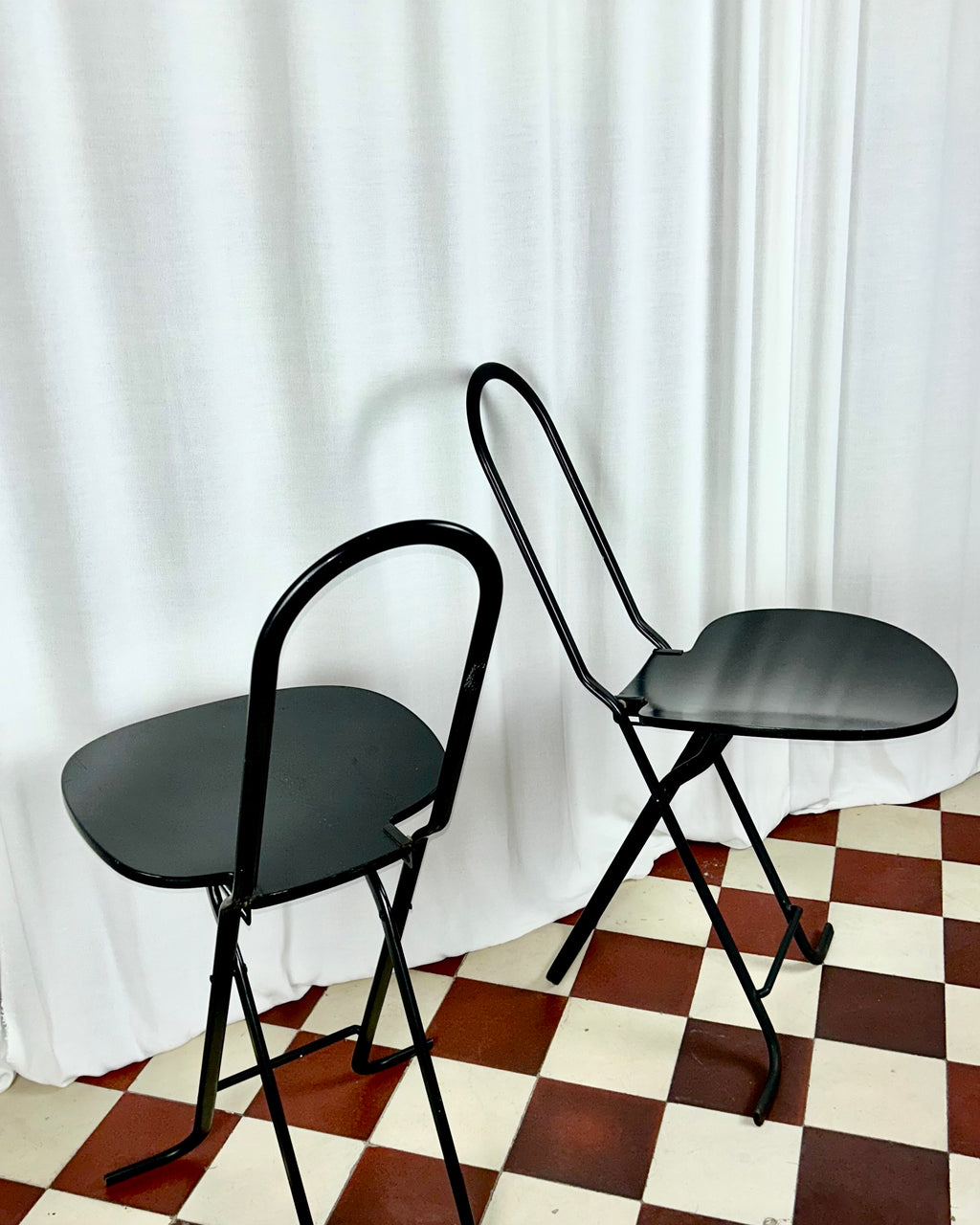Two black foldable "Dafne" chairs by Gastone Rinaldi for the Italian manufacturer Thema, seen from above