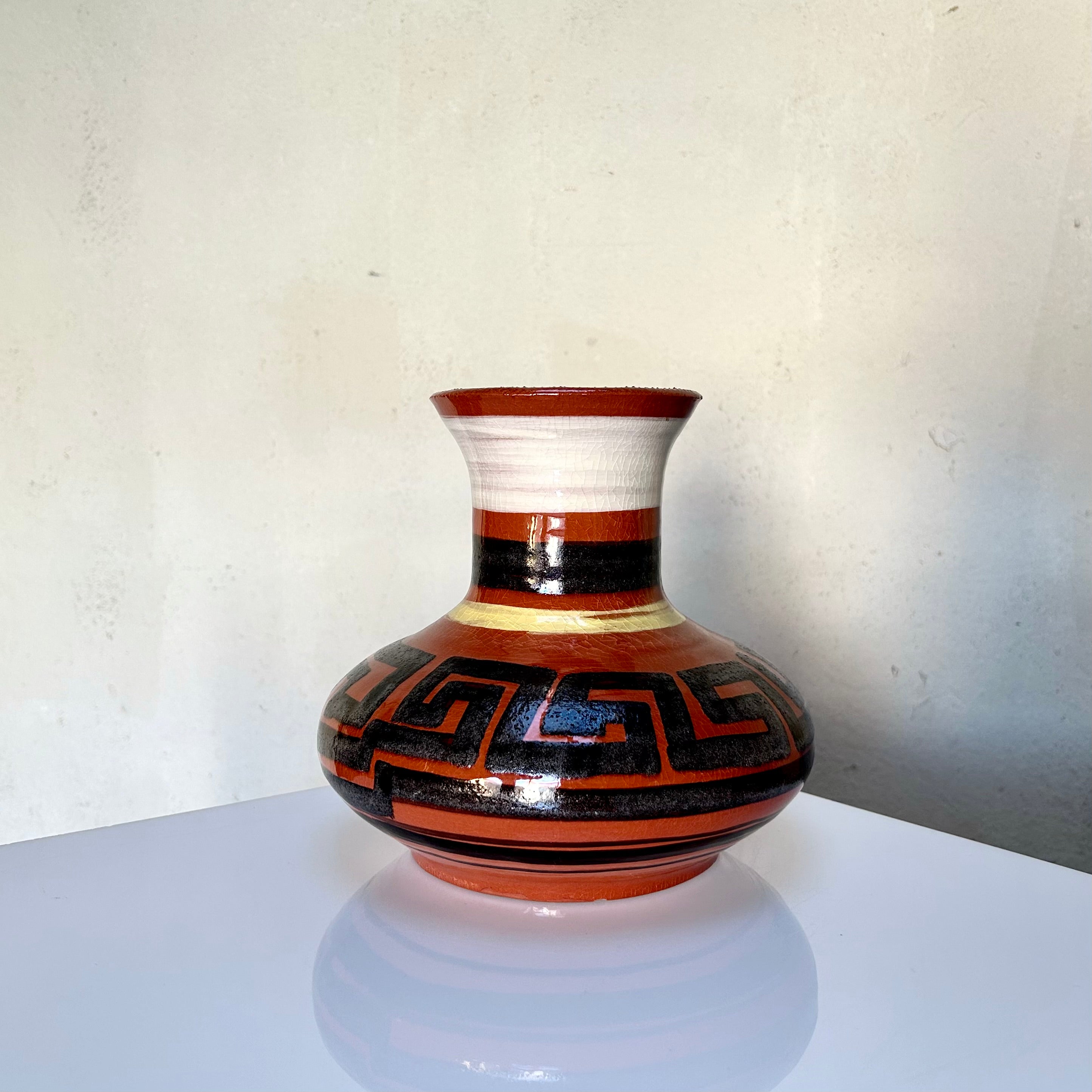 Swedish handcrafted deep terracotta colored vase with bold black geometric pattern, signed "BAR 1992".