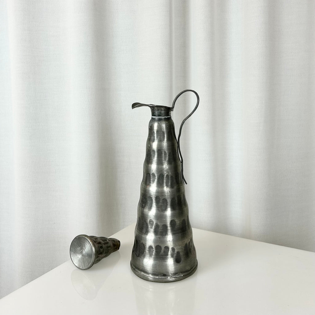 Norwegian pewter jug with hammered surface, conical shape and detachable lid, 29.5 cm tall