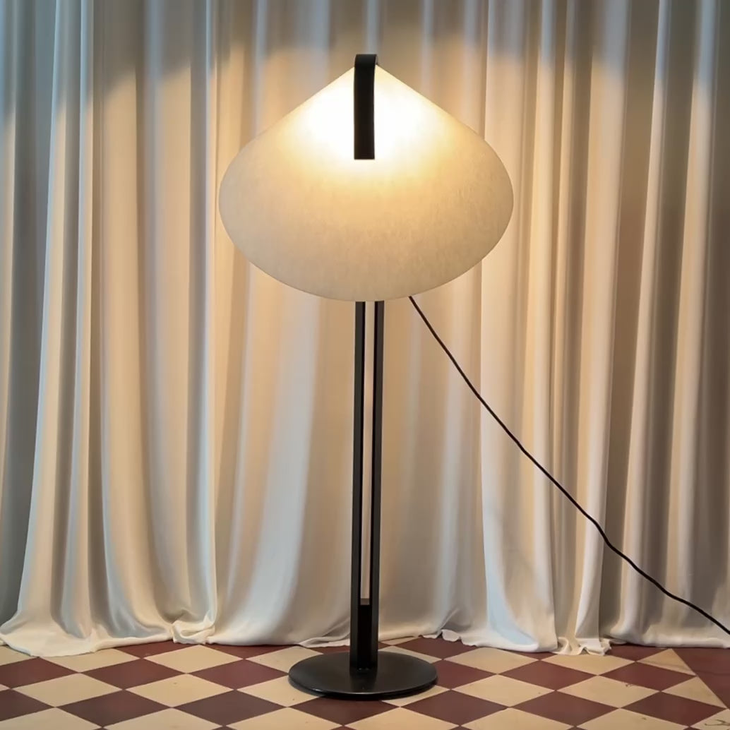 A short video that shows a black and white floor lamp by the Danish manufacturer Domus in on and off light mode