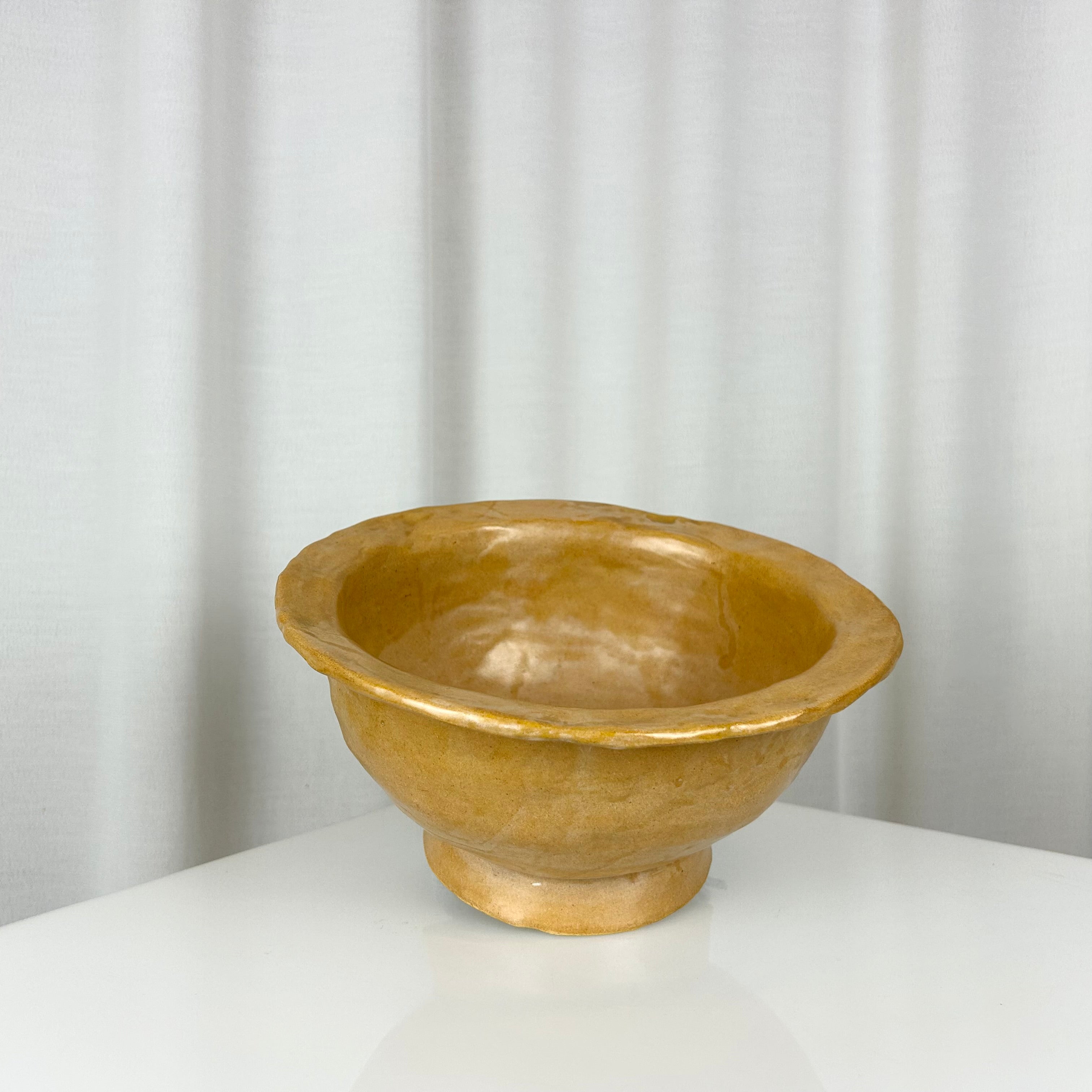 Vintage handmade ceramic ochre bowl with rich glaze, deep profile and small foot, H 12 cm, Ø 24.5 cm