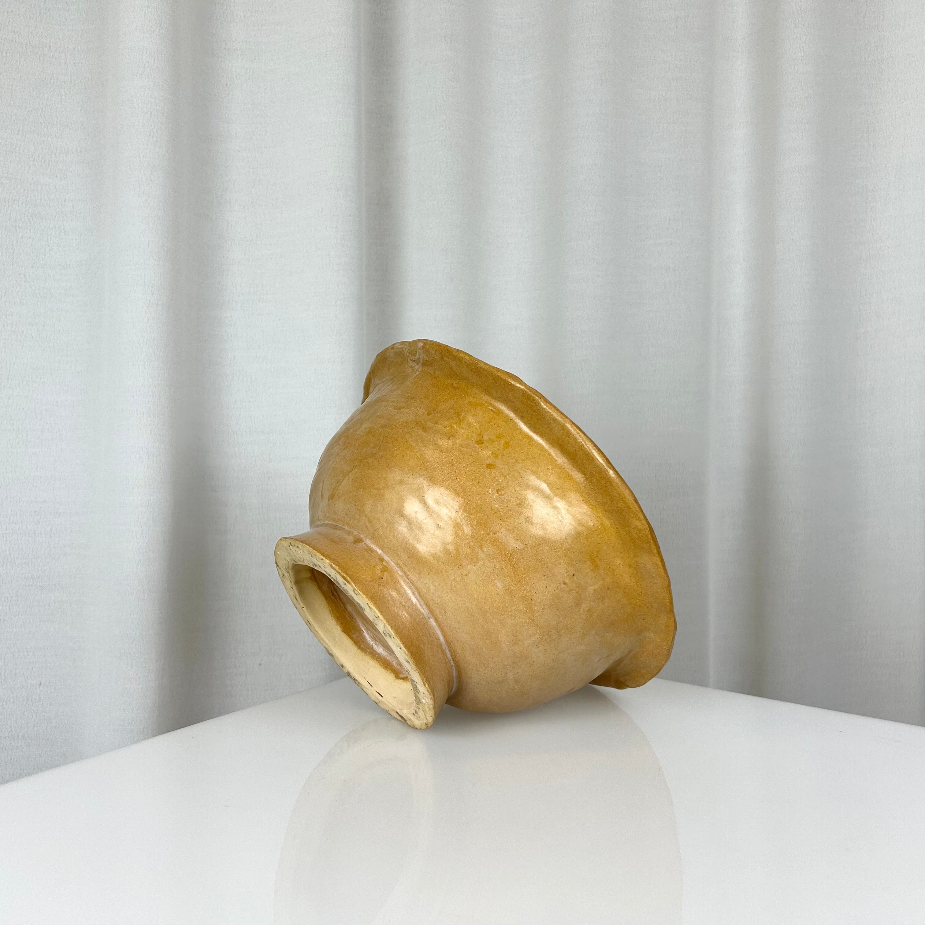 Vintage handmade ceramic ochre bowl with rich glaze, deep profile and small foot, H 12 cm, Ø 24.5 cm