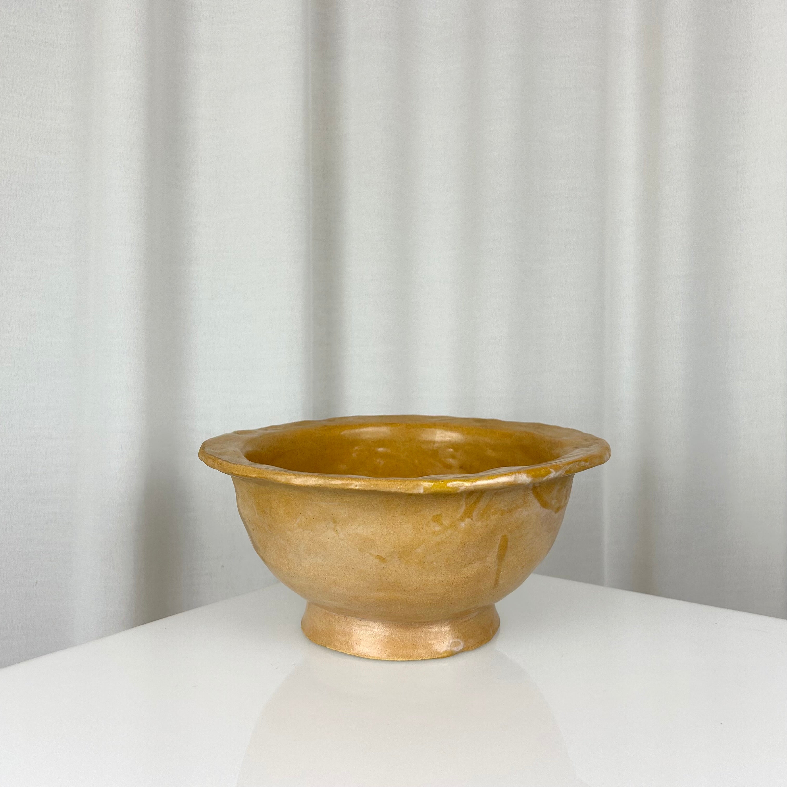Vintage handmade ceramic ochre bowl with rich glaze, deep profile and small foot, H 12 cm, Ø 24.5 cm