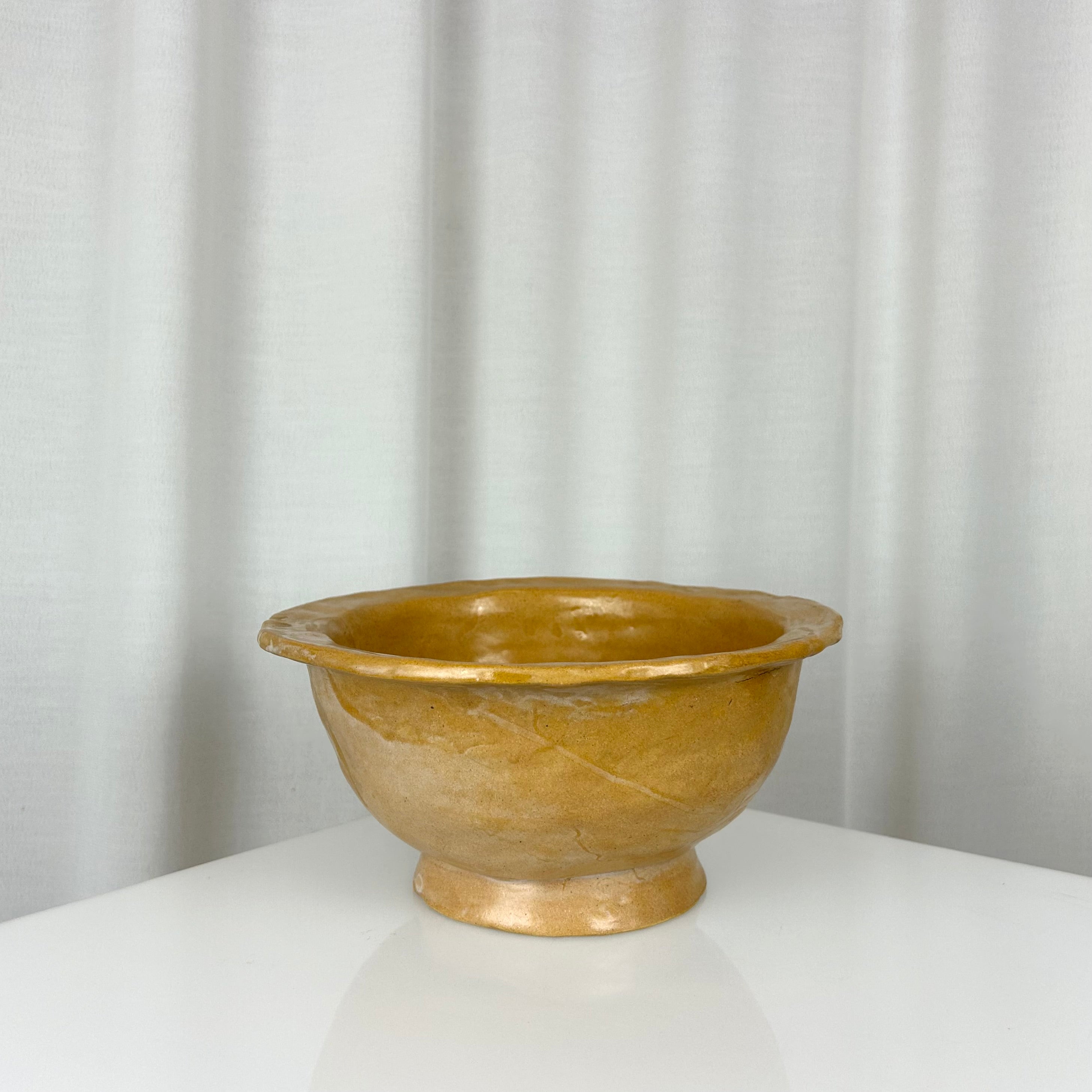 Vintage handmade ceramic ochre bowl with rich glaze, deep profile and small foot, H 12 cm, Ø 24.5 cm