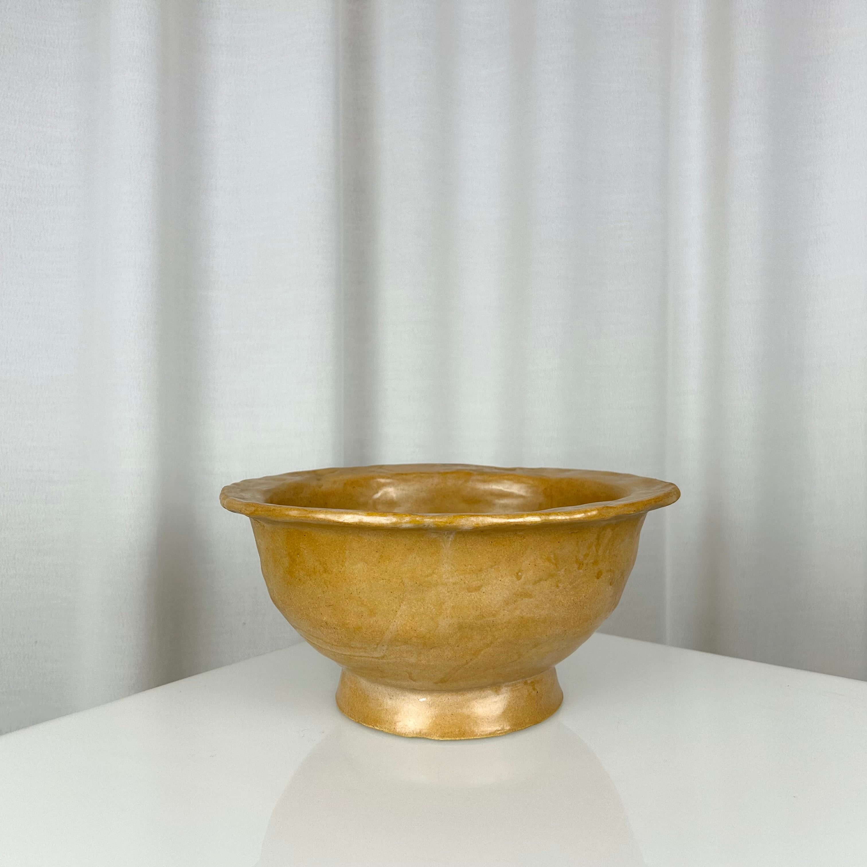 Vintage handmade ceramic ochre bowl with rich glaze, deep profile and small foot, H 12 cm, Ø 24.5 cm