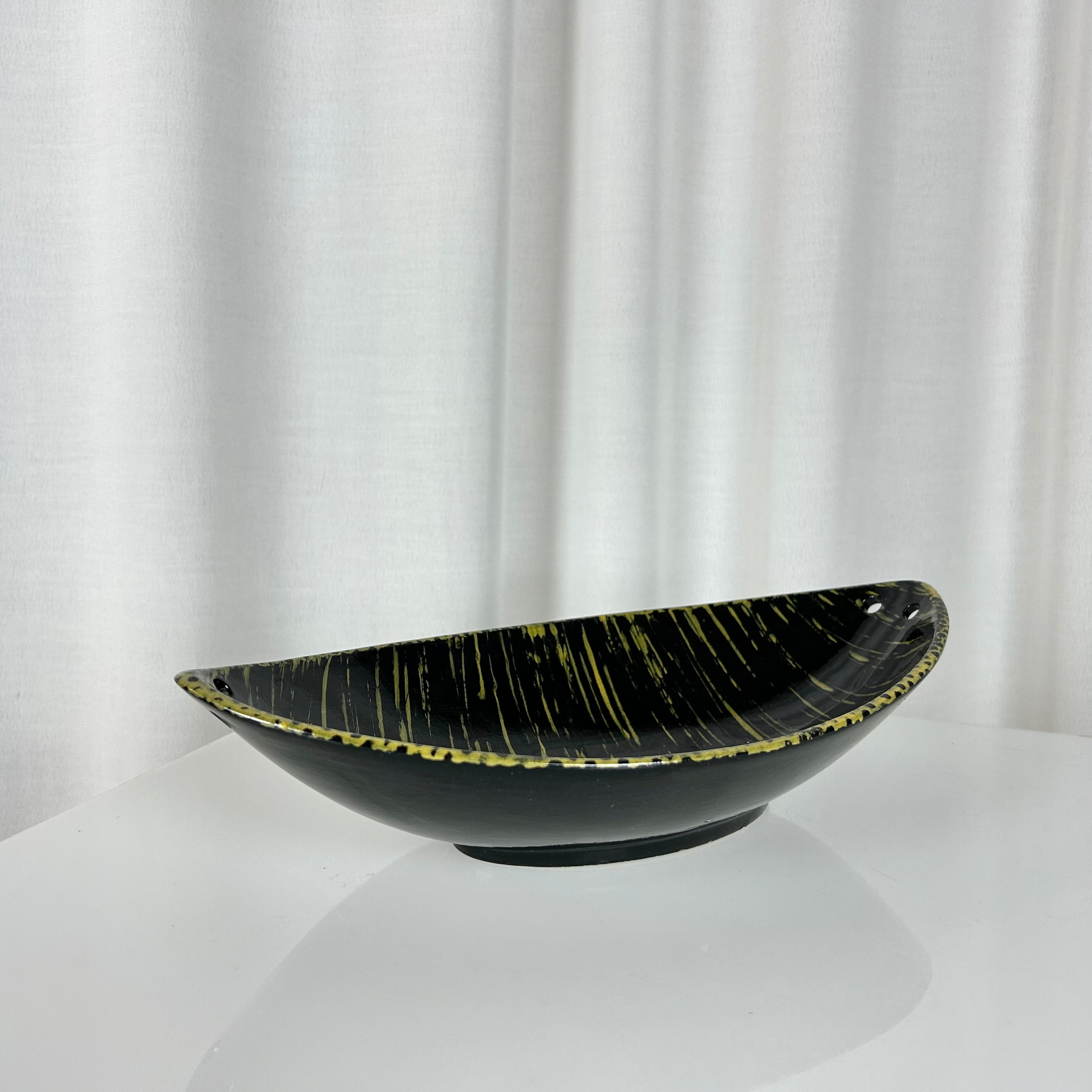 Vintage mid-century oval shaped ceramic bowl in black and yellow glaze, West Germany 1950s
