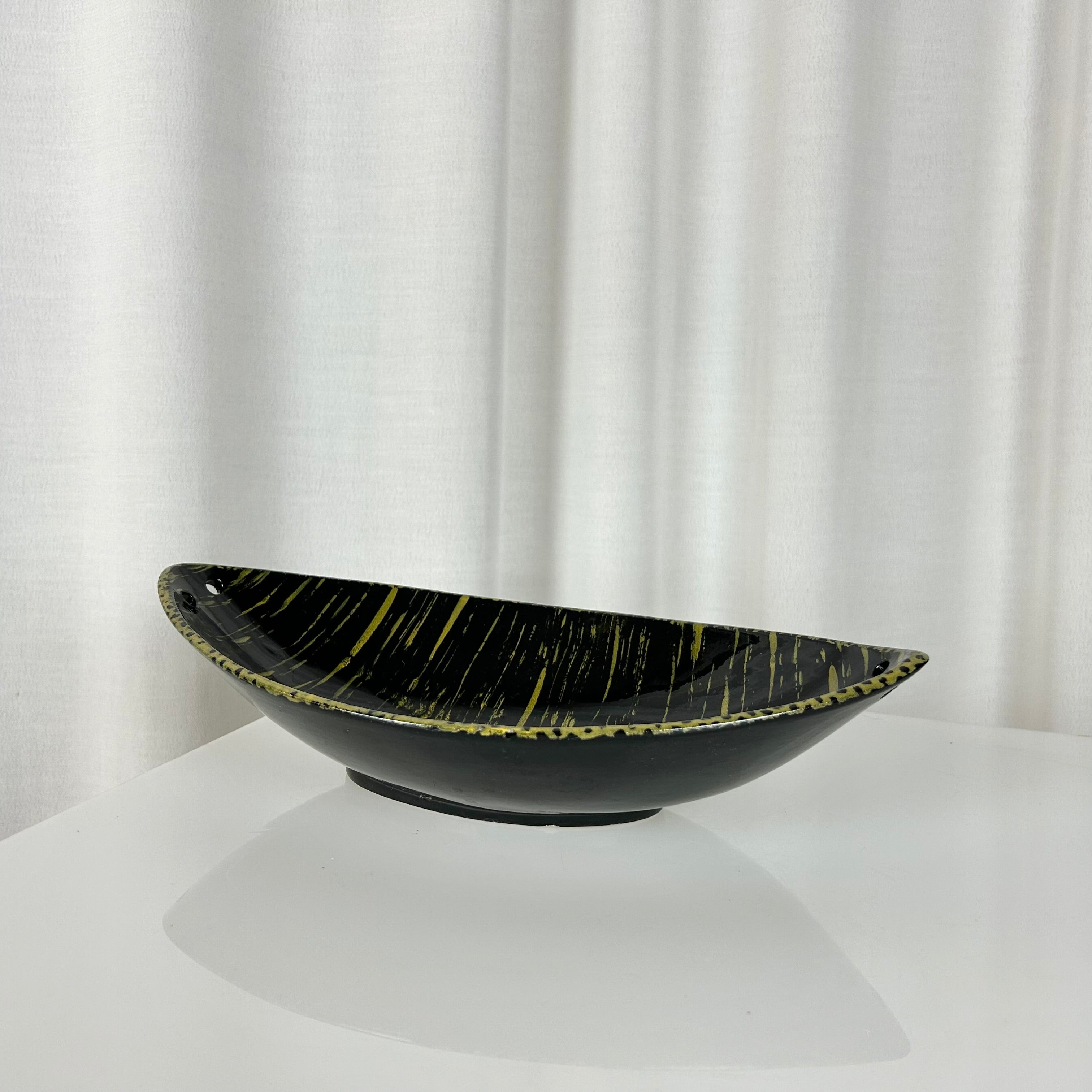 Vintage mid-century oval shaped ceramic bowl in black and yellow glaze, West Germany 1950s