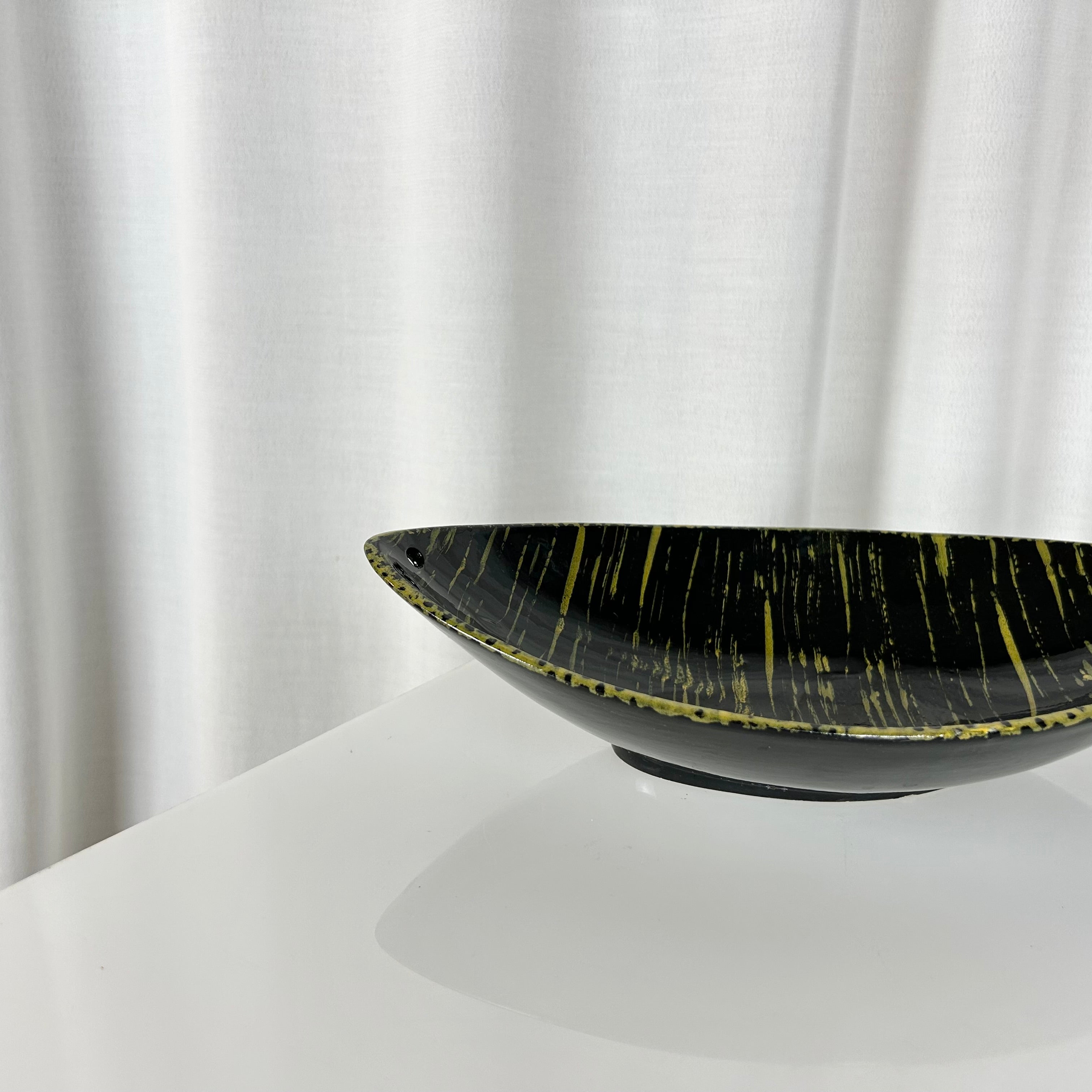Vintage mid-century oval shaped ceramic bowl in black and yellow glaze, West Germany 1950s
