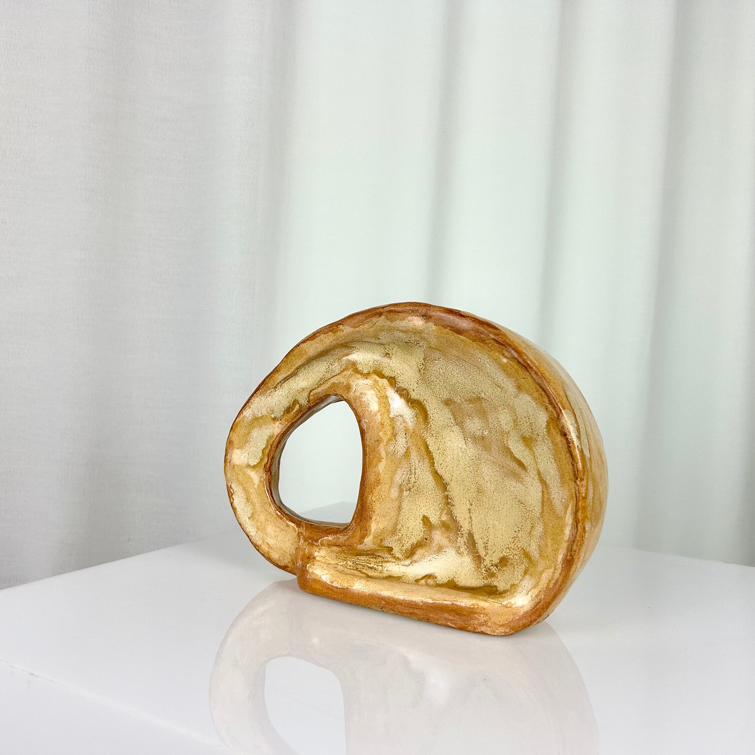 Vintage ceramic vase in sculptural circular form with ochre glaze