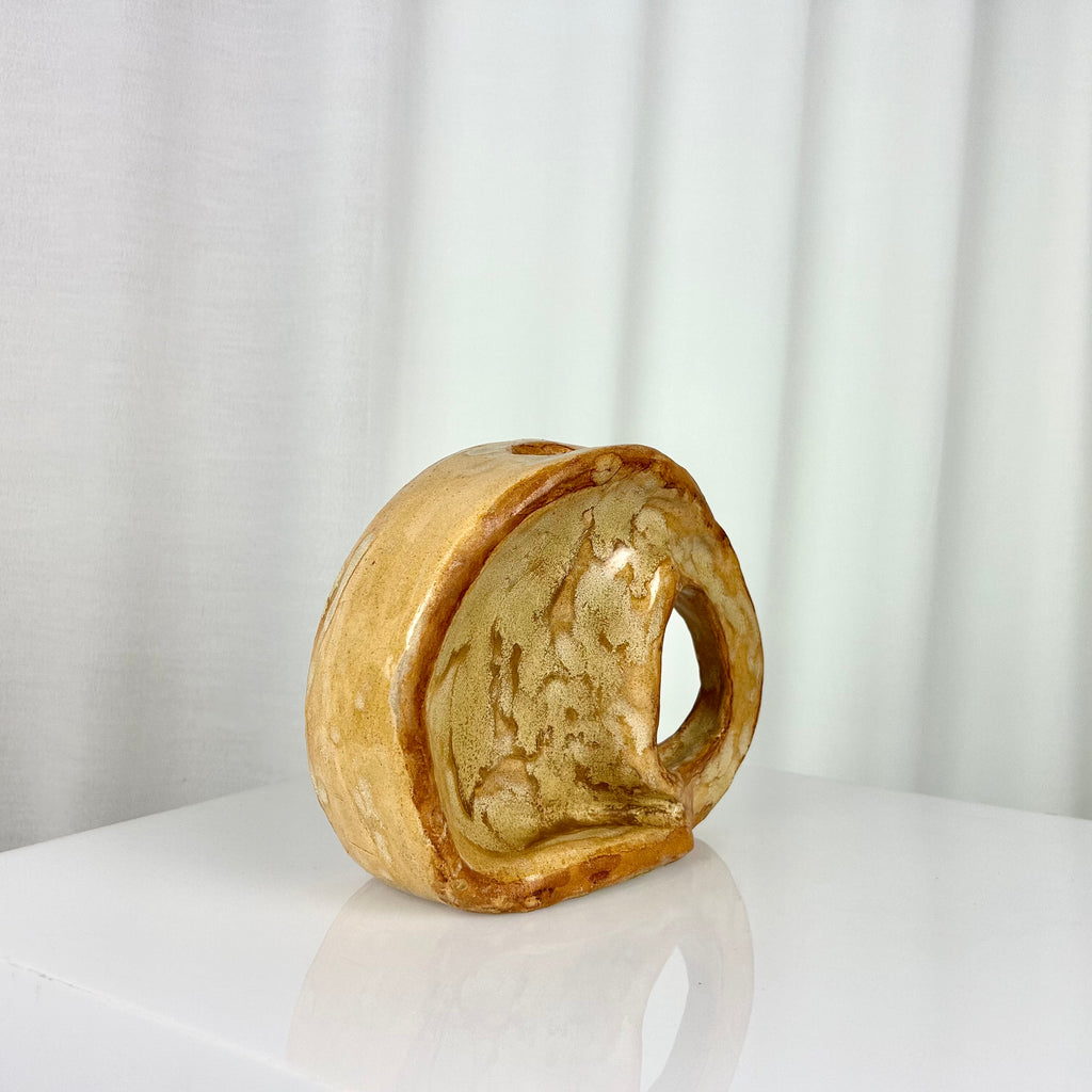 Vintage ceramic vase in sculptural circular form with ochre glaze