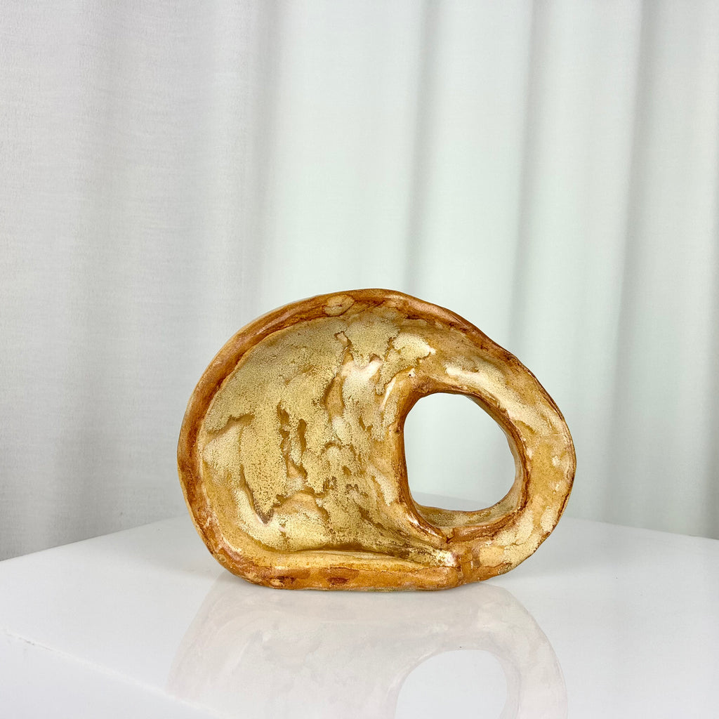 Vintage ceramic vase in sculptural circular form with ochre glaze