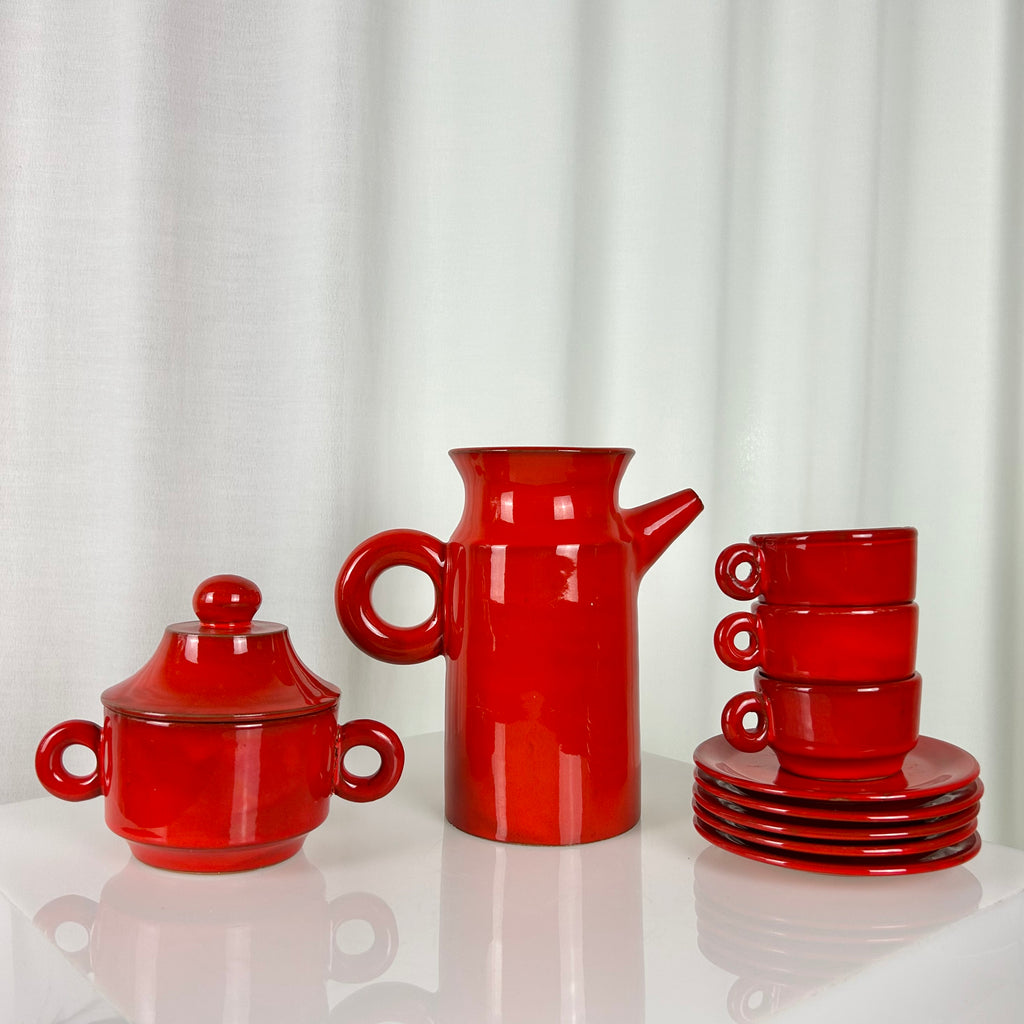 Vintage red ceramic coffee set from the 1970s with pot, sugar bowl, cups and saucers