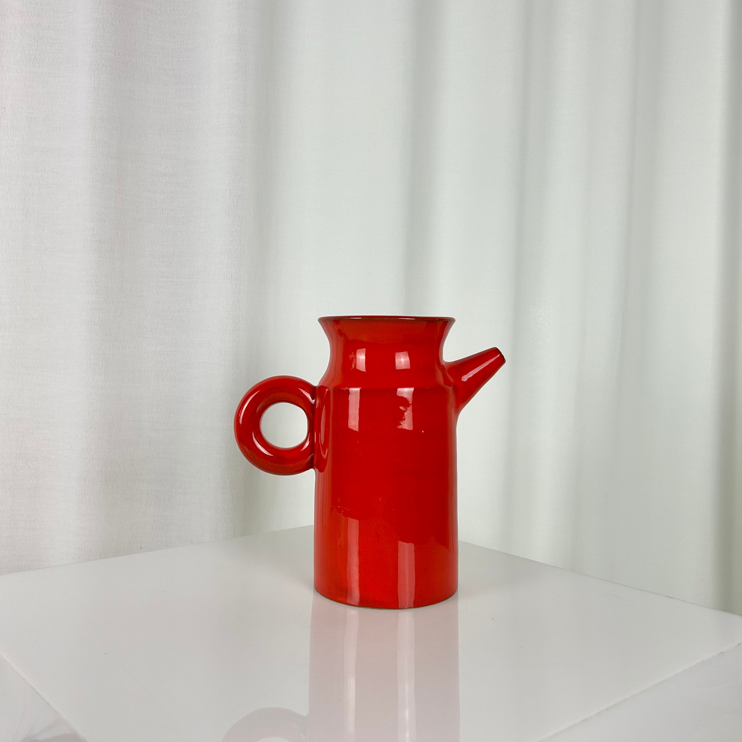 Vintage red ceramic coffee set from the 1970s with pot, sugar bowl, cups and saucers
