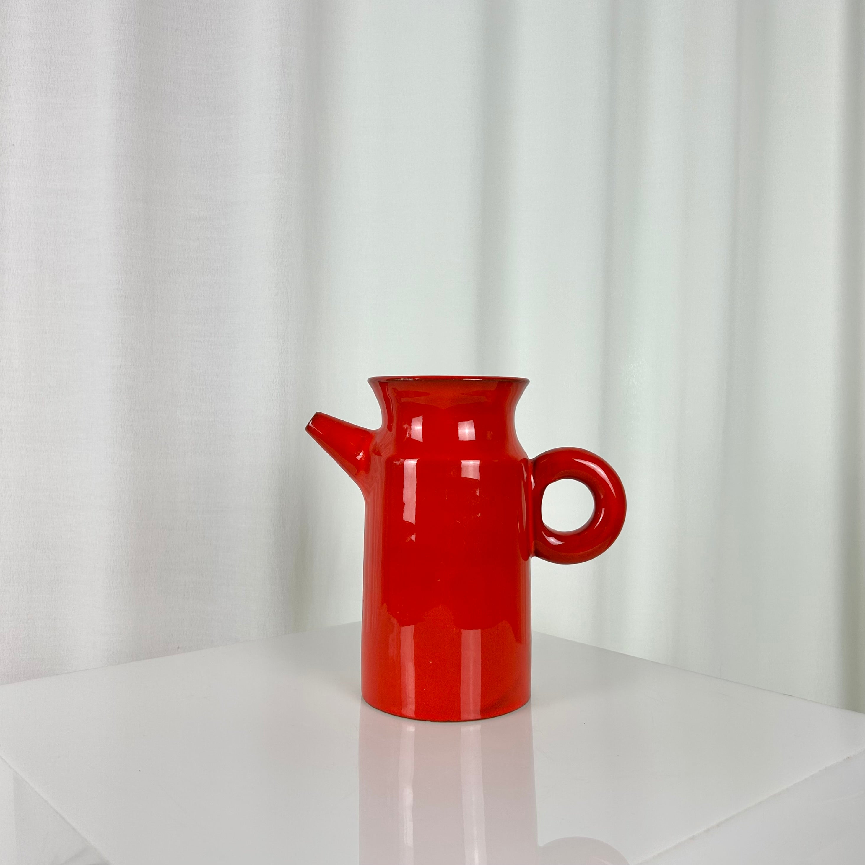 Vintage red ceramic coffee set from the 1970s with pot, sugar bowl, cups and saucers