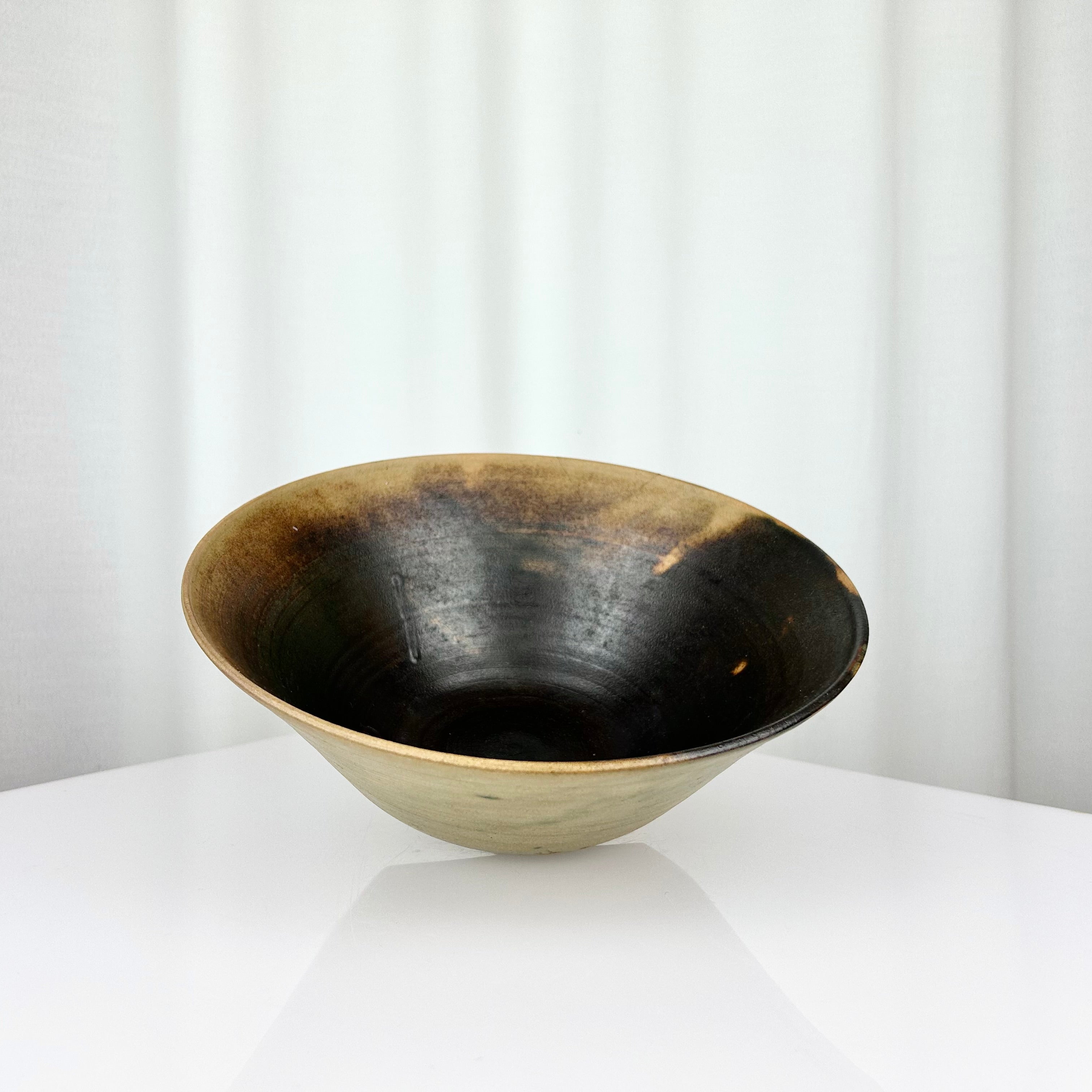 Vintage studio pottery hand-thrown bowl with dark beige and green glaze, inside