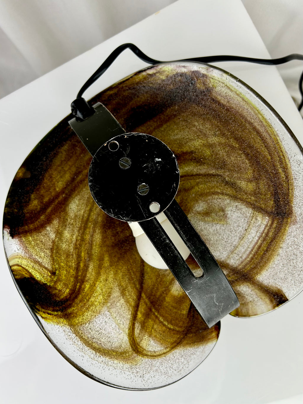 Backside of a vintage wall lamp by Per Lütken for Holmegaard, featuring a mouth-blown glass sconce with smoky brown swirls, 1970s Danish design.