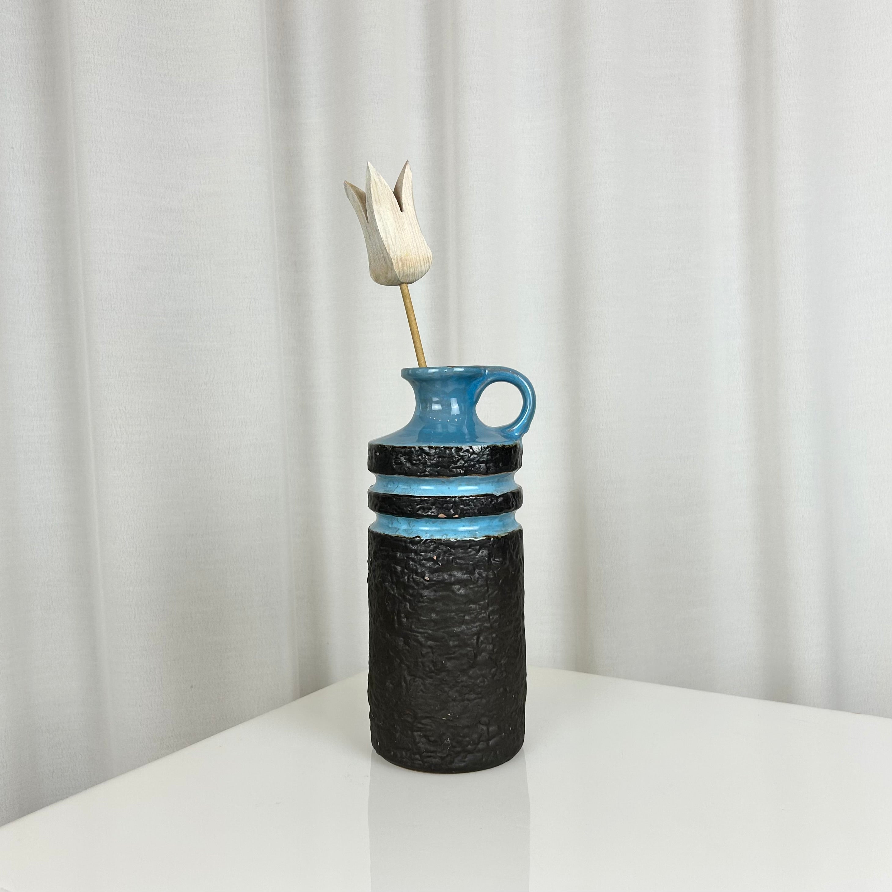 West German fat lava style ceramic vase with textured matte black body and glossy blue rings