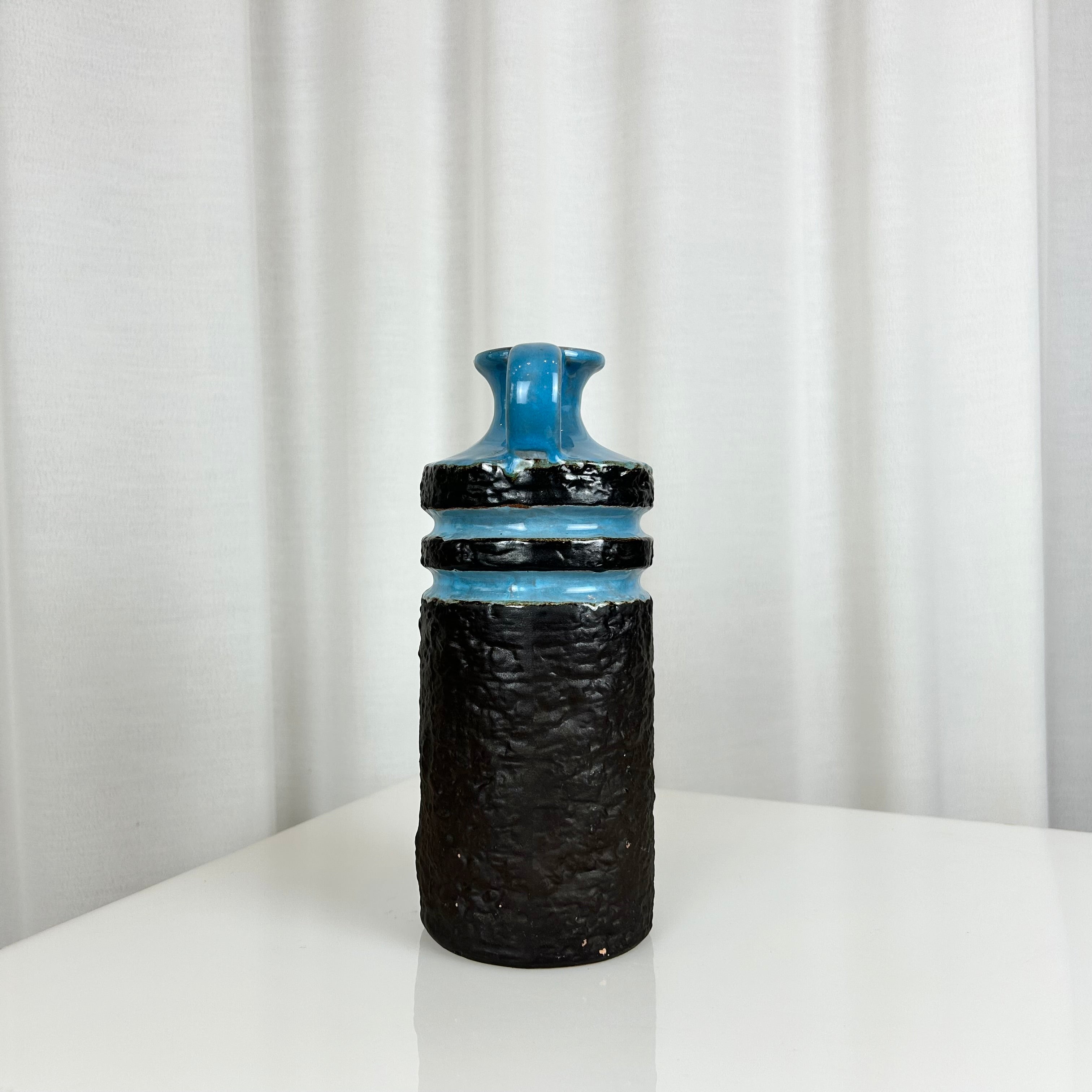 West German fat lava style ceramic vase with textured matte black body and glossy blue rings
